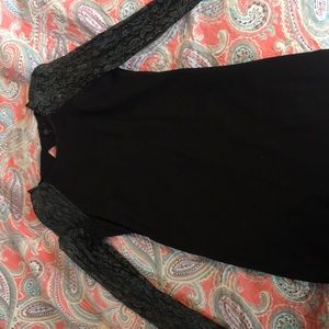 Black dress with lace sleeves.